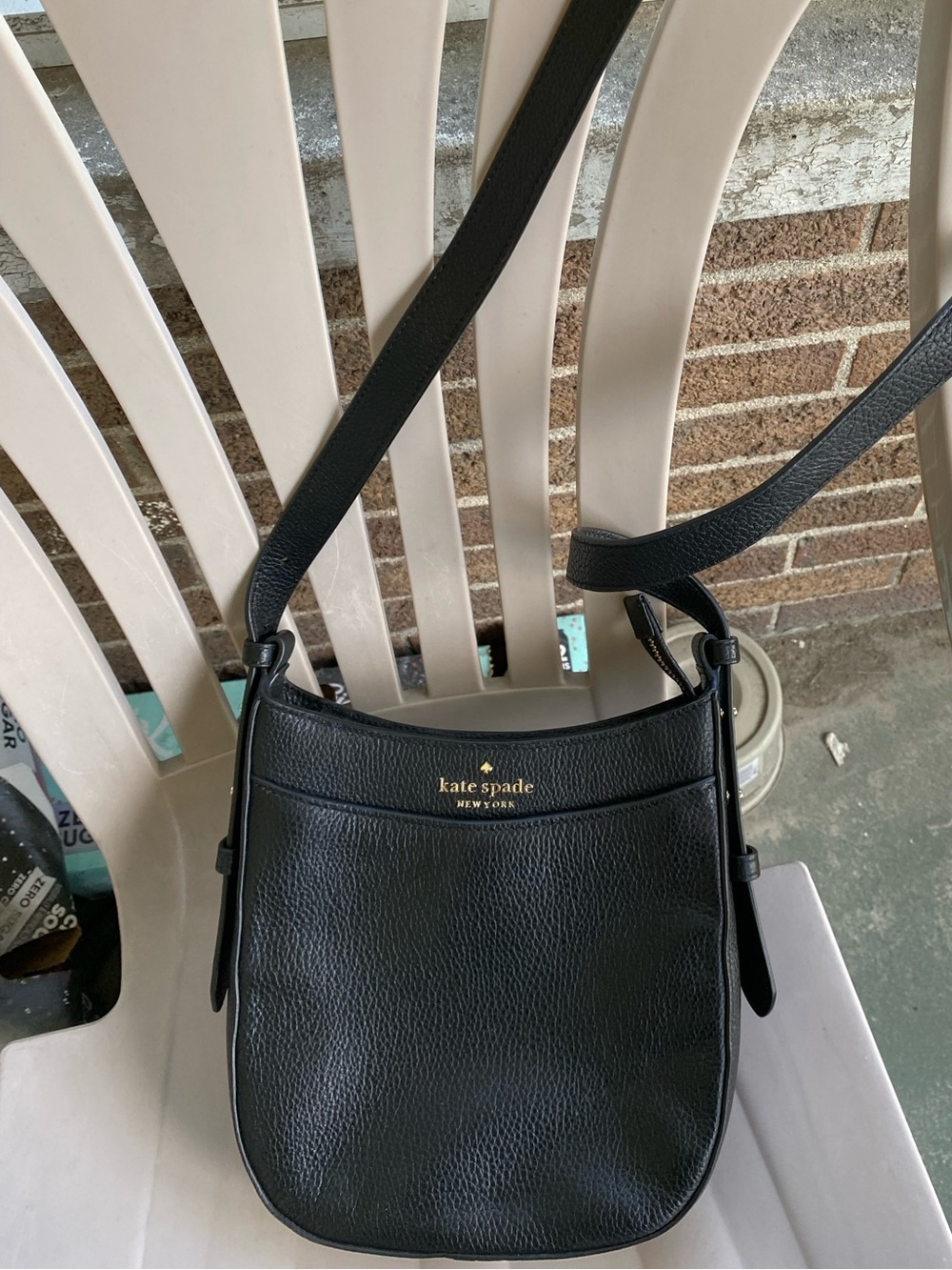 kate spade black pebbled leather crossbody with gold logo